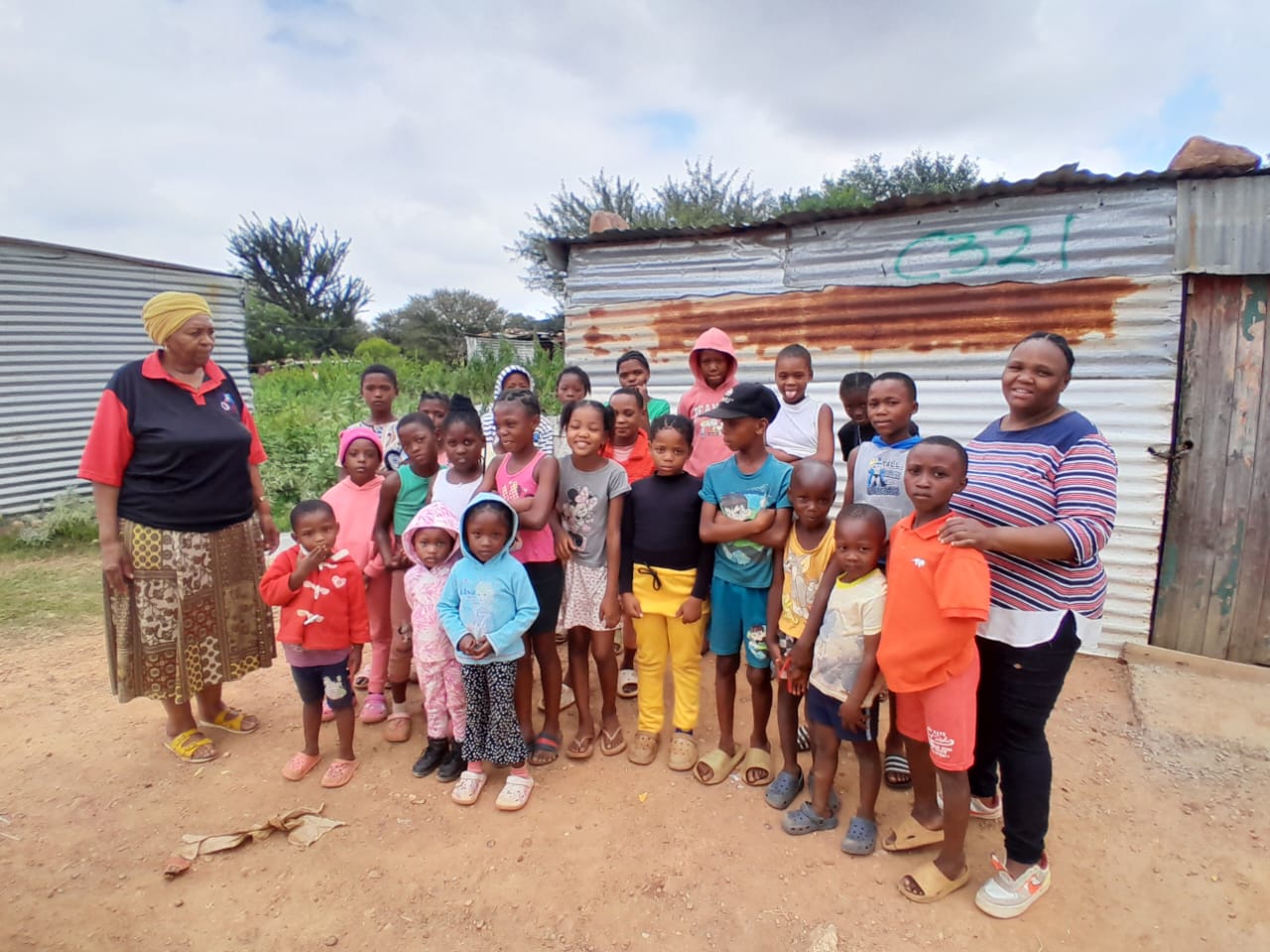 Anna with kids in an Ikageng Easter Party Club.